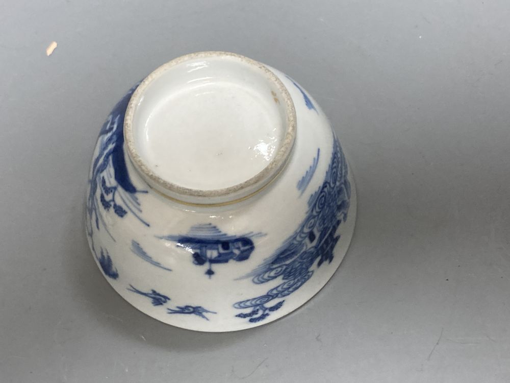 An 18th century English blue and white tea bowl and three smaller Chinese ceramic cups, two marks